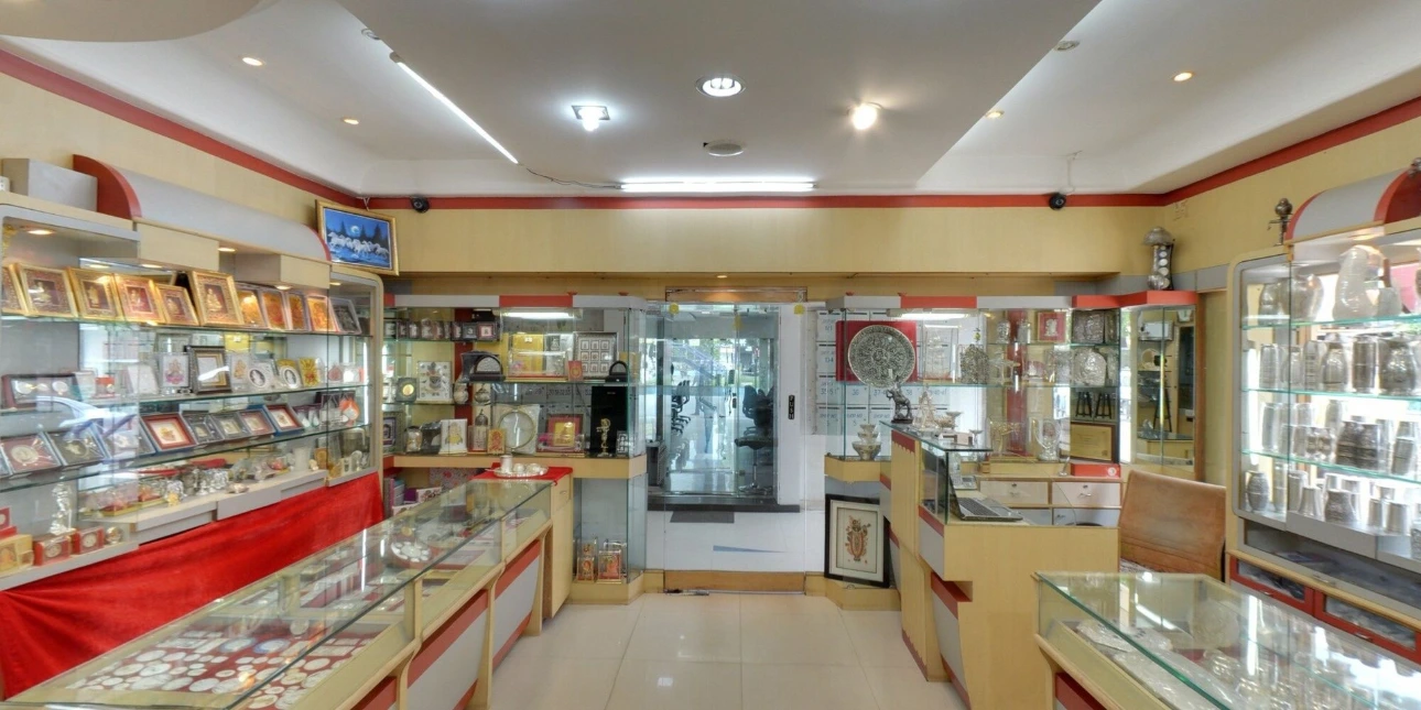Silver article showroom, pure silver shop near me, silver gift store interior, buy silver pooja items in-store